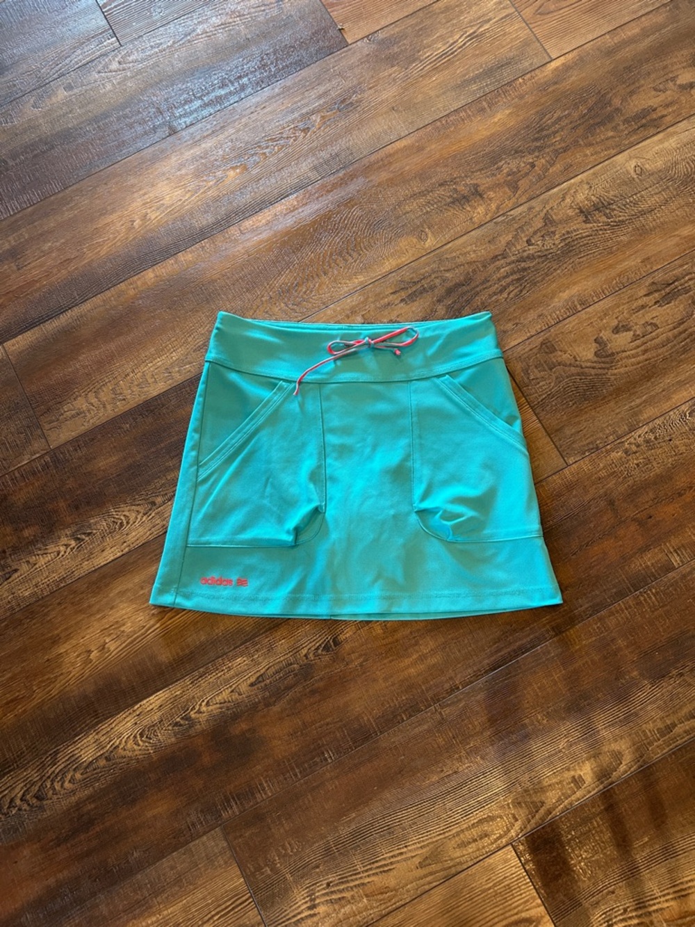 adidas golf skirt  Teal Skort with Pink Logo